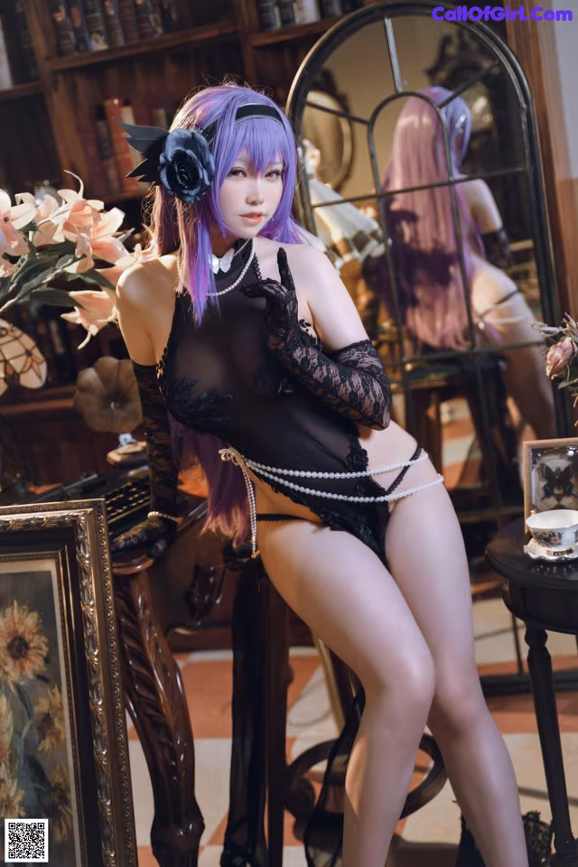 A woman in a black lingerie posing in front of a mirror.
